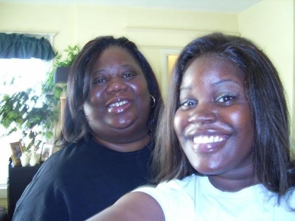 Mother and daughter laughing together at home